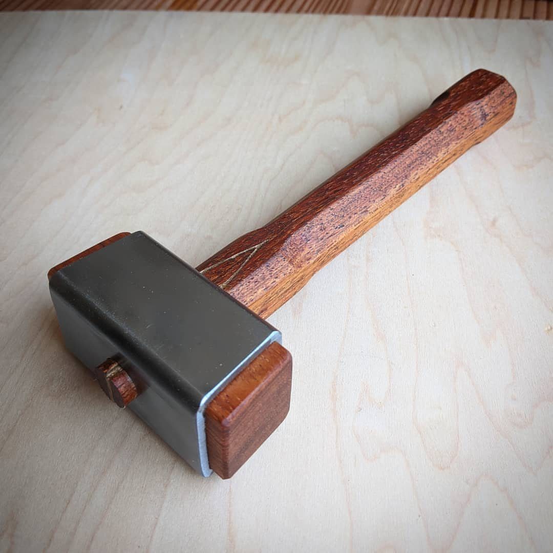 Carpenter Tools with Name: 7 Basics for Every Toolbox 4 Wooden mallet with metal head resting on a light plywood surface