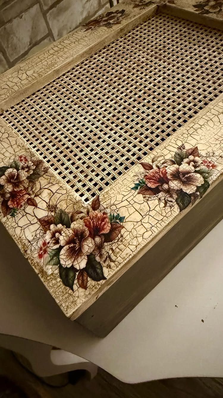 Crackled cream furniture with floral corner designs and a woven cane center panel.
