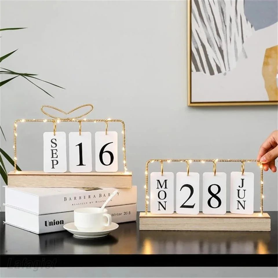 14 DIY Home Decor Wood Ideas for Every Room in the House 14 Wooden perpetual calendars with white flip cards on a dark table with books.