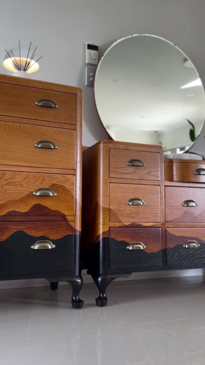 Wooden dressers with a black painted bottom and wavy mountain-like transition to natural wood.