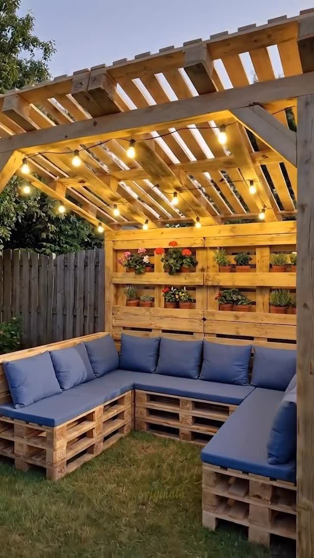 5 DIY Pallet Gazebo Ideas for Backyard Shade and Seating 2 Pallet gazebo lounge area with blue cushions, string lights, and integrated planter boxes.