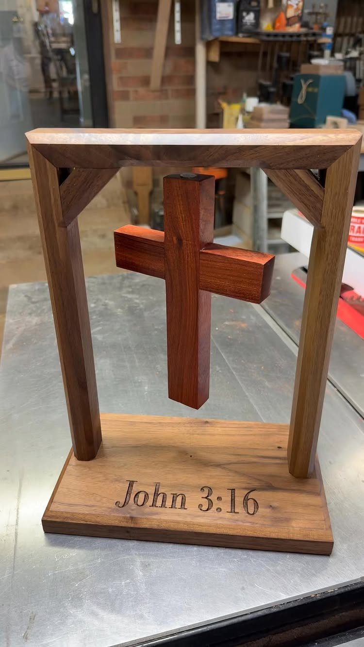 DIY Wooden Crosses: 5 Ideas, from Woven to Carved 3 Wooden cross suspended in a frame with John 3:16 engraved on the base.