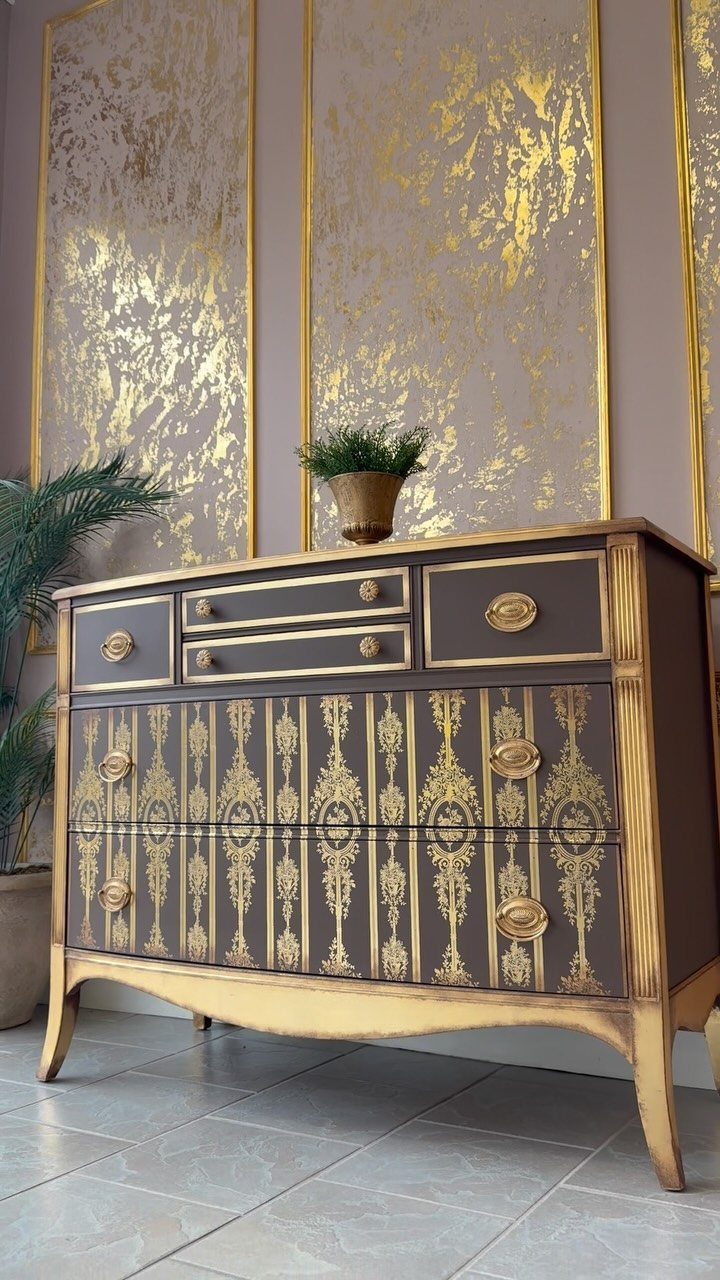 Refurbished dark brown dresser with gold stenciled patterns and gold painted trim.