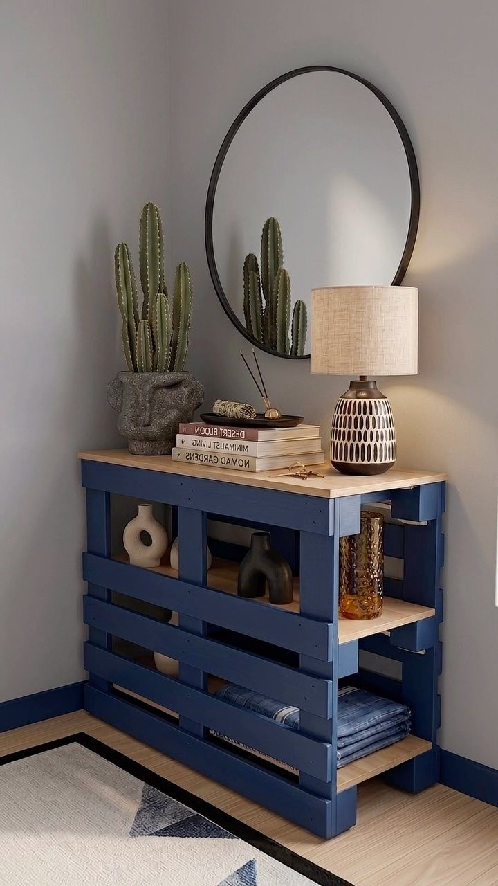 9 Easy to Make Furniture Ideas for Beds, Benches and More 3 Blue wooden console table with a light wood top and a round mirror above.