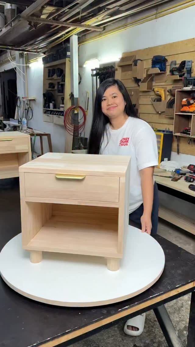 9 Easy to Make Furniture Ideas for Beds, Benches and More 8 Small light wood nightstand with a drawer on a white rotating table.