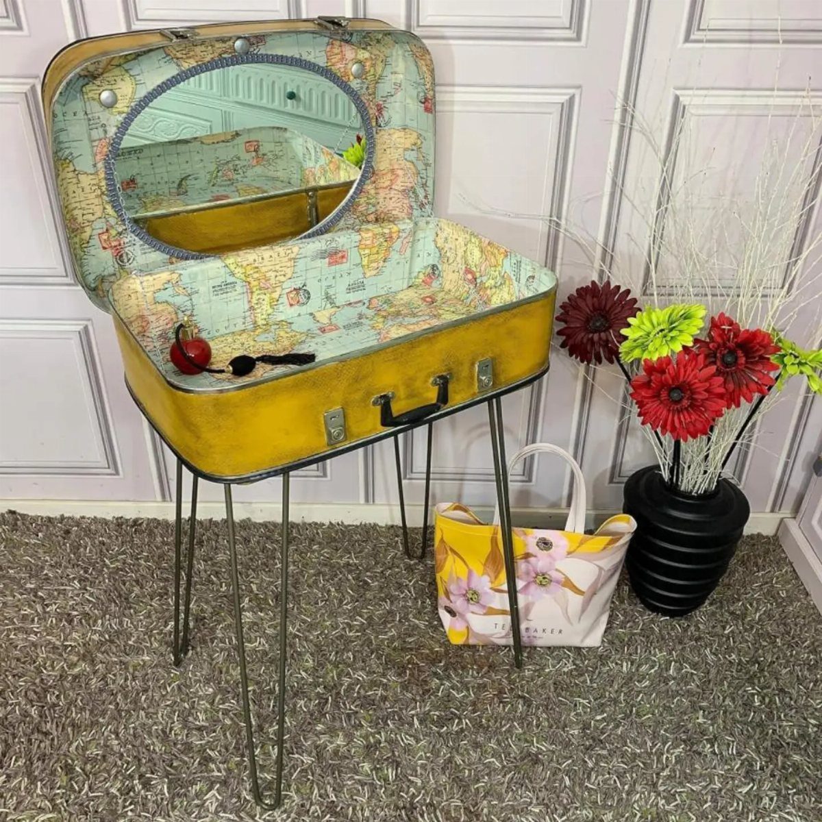 9 Easy to Make Furniture Ideas for Beds, Benches and More 4 Yellow vintage suitcase side table with world map lining and thin metal legs.