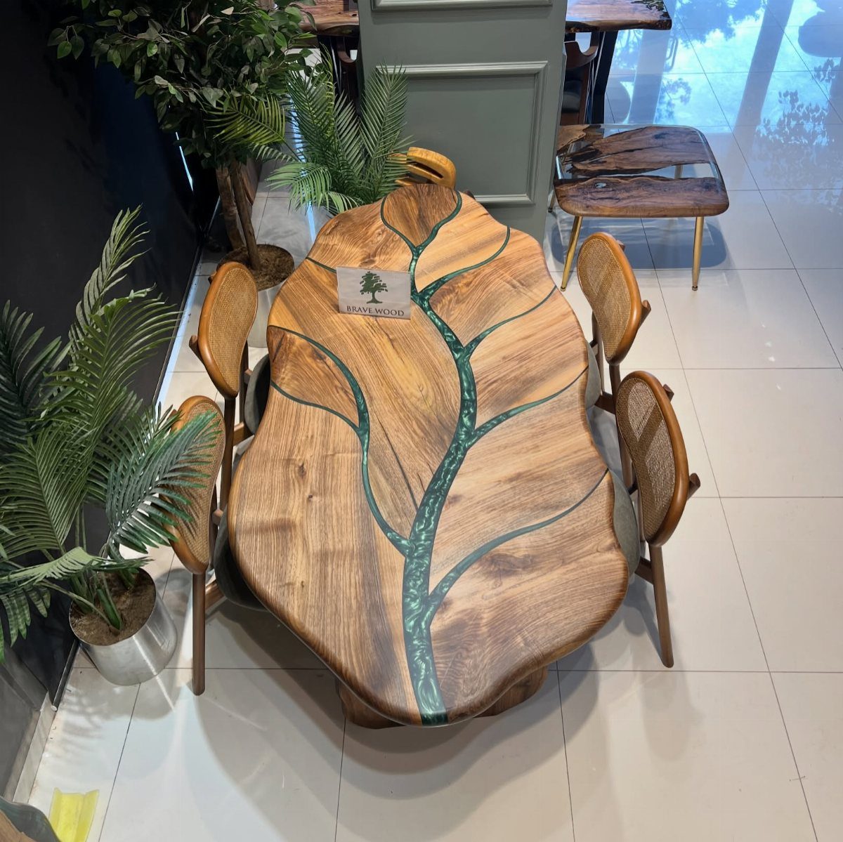 9 Epoxy Resin Wood Projects: Tables, Trays, Clocks and Coasters 6 Live-edge wooden dining table with teal epoxy resin fills and matching cane chairs.