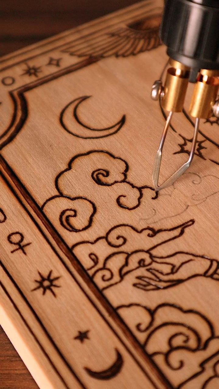 How to Burn Wood Art: 12 Ideas for Every Skill Level 12 Wood-burning tool etching a celestial design with a moon and clouds into wood