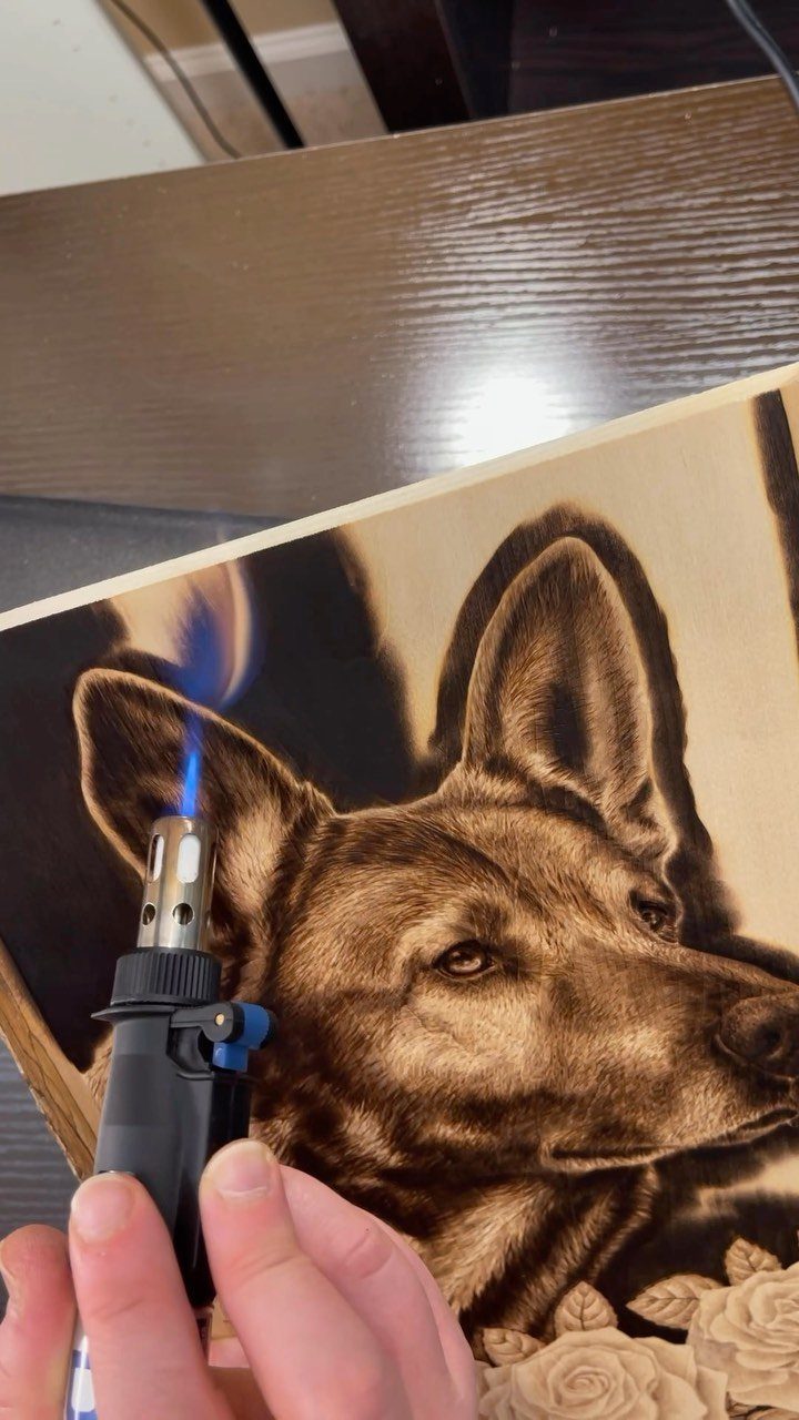 How to Burn Wood Art: 12 Ideas for Every Skill Level 8 Handheld torch burning a detailed dog portrait into a light wooden board.