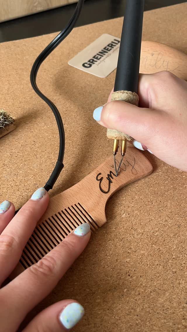 How to Burn Wood Art: 12 Ideas for Every Skill Level 3 Hands using a wood-burning tool to engrave a name on a wooden comb.