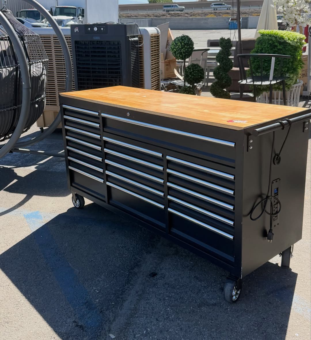 Mobile Tool Cabinet Ideas: 5 Options for Your Garage 1 Black rolling tool chest with multiple drawers and a wooden countertop on casters.