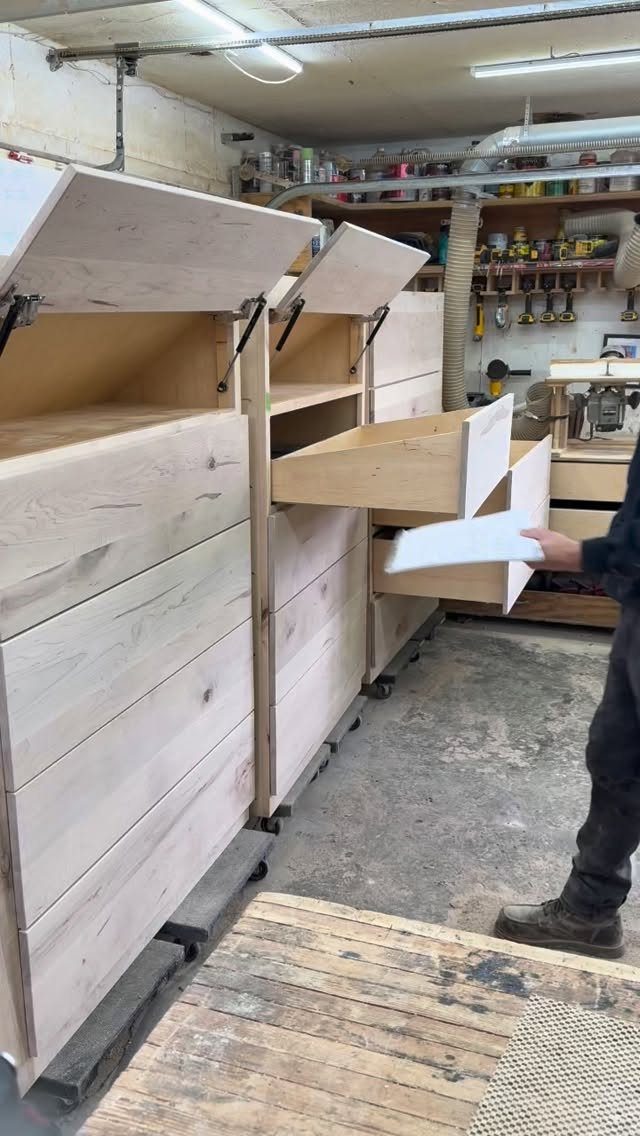 Paint Storage Cabinet Ideas: 6 Options for Art and Workshop 5 Wooden storage cabinet with drawers and flip-up lids in a workshop setting.
