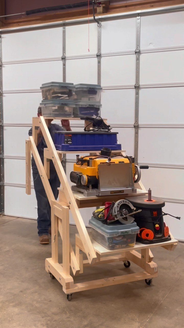 14 Shop Class Projects to Build: Bookshelf to Plywood Cart 11 Multi-tiered wooden mobile workbench holding power tools and storage bins in a garage