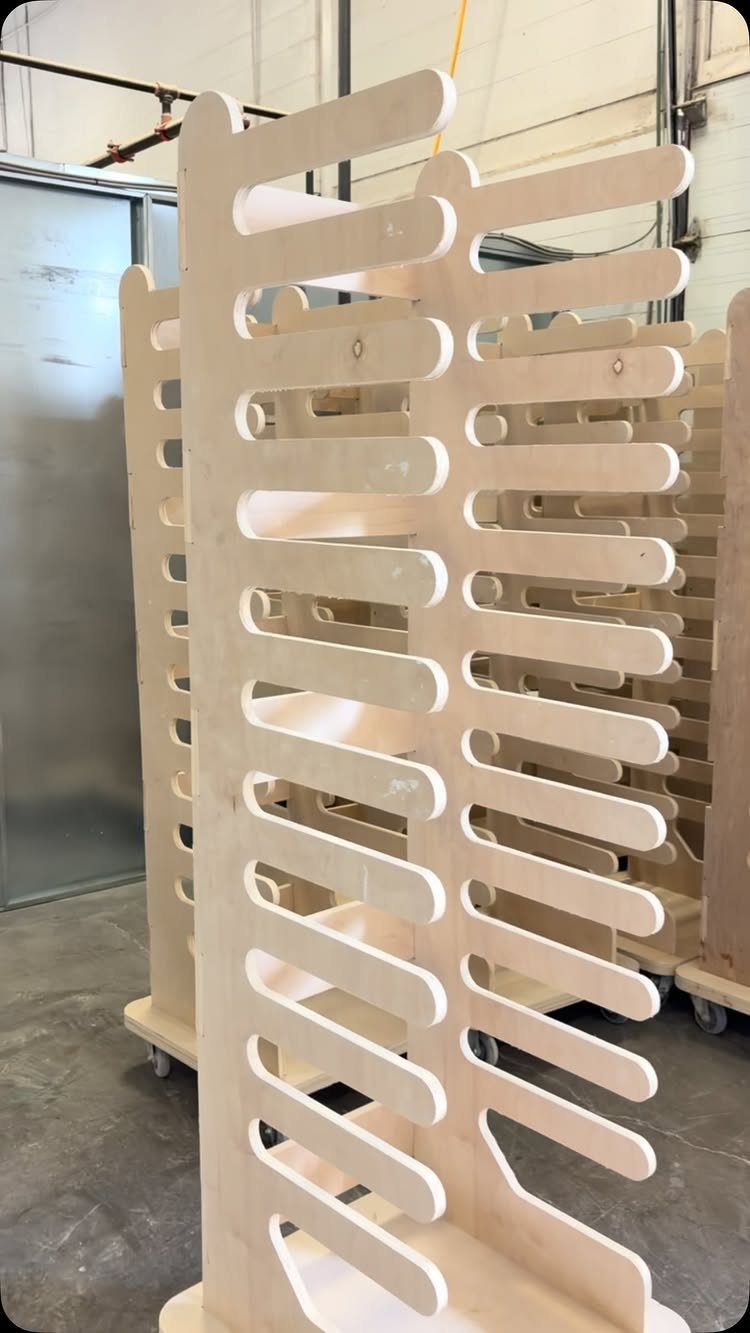 14 Shop Class Projects to Build: Bookshelf to Plywood Cart 12 Plywood storage racks with rounded slots on wheels in an industrial workshop