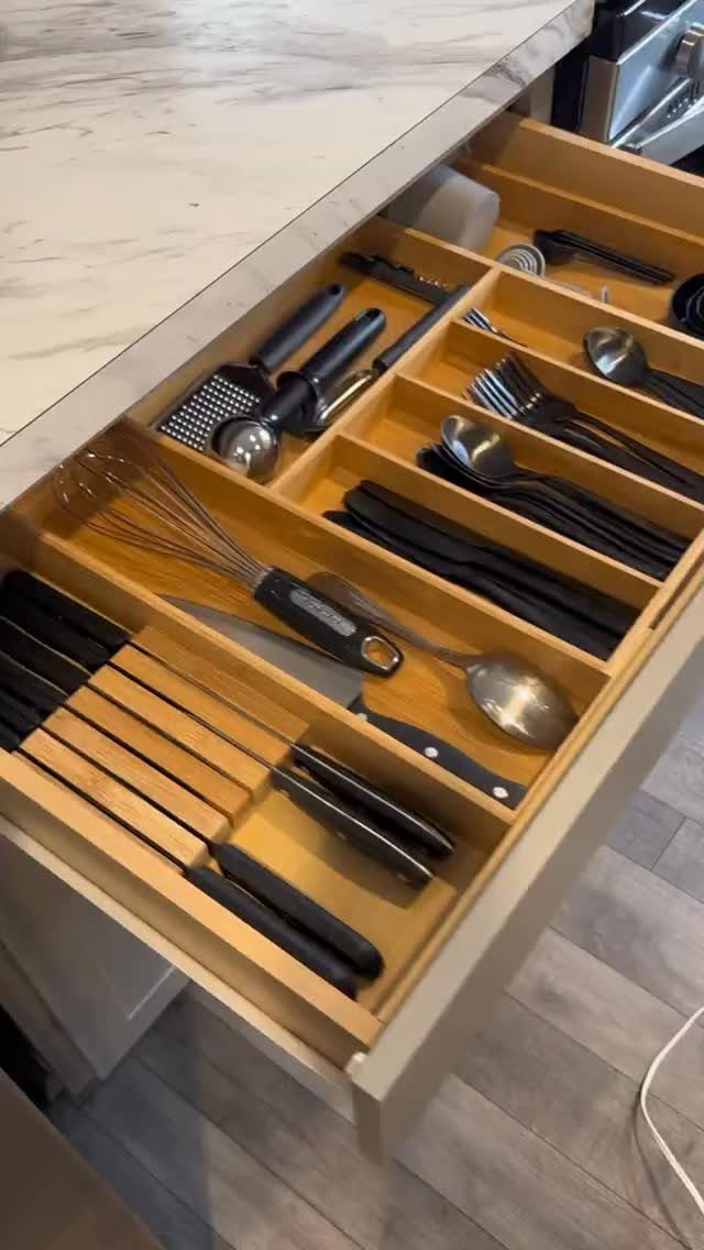 12 Small Wood Projects for Beginners to Build This Weekend 9 Wooden kitchen utensil drawer organizer holding various cooking tools in a light-colored cabinet.