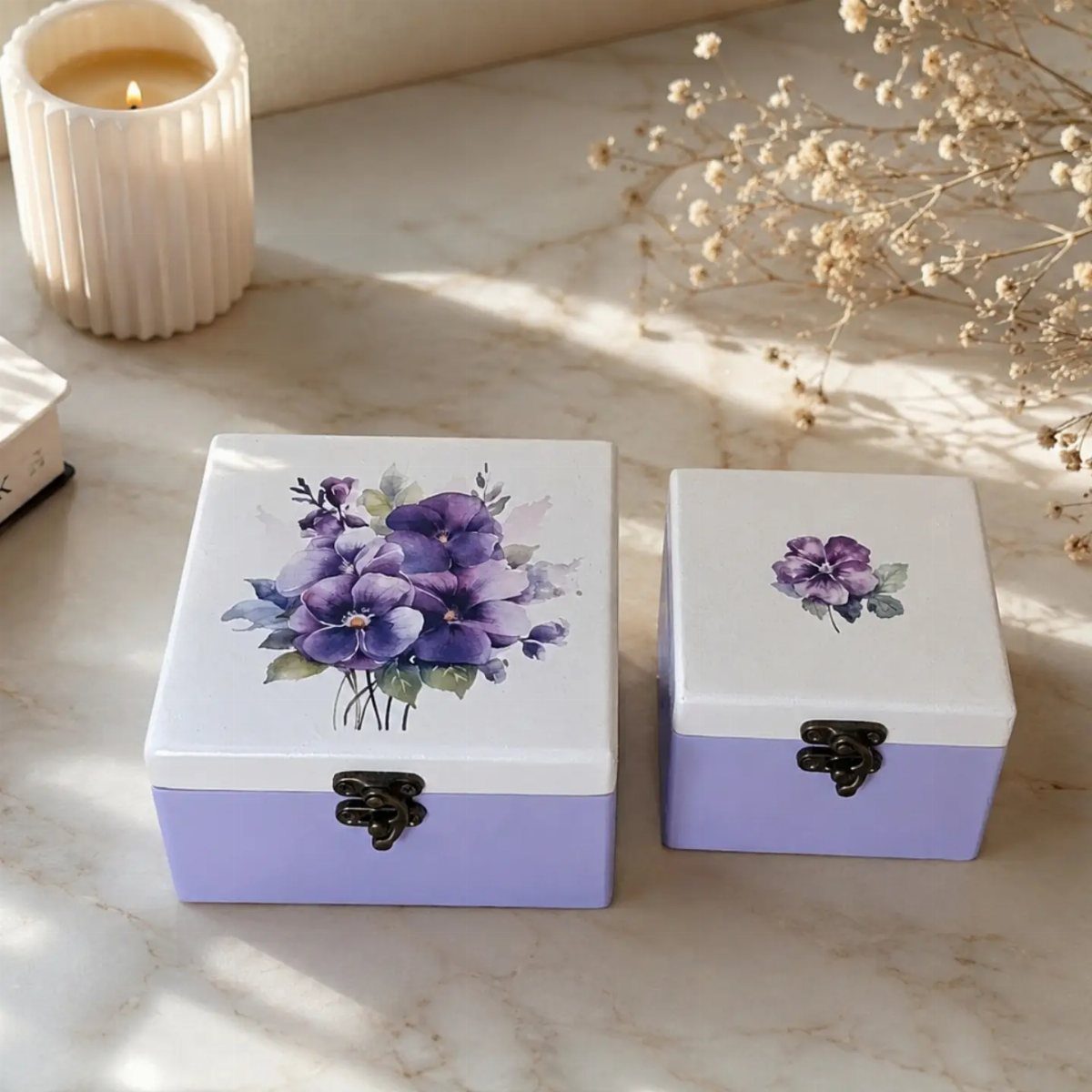 Two small purple and white painted wooden jewelry boxes with floral designs.