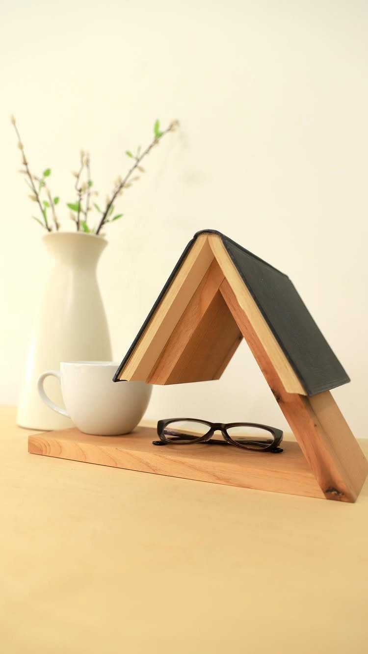 Small Wooden Rack Ideas: 9 Shelves, Stands and Holders 3 Light-colored wooden book holder supporting an open book with a white coffee cup.