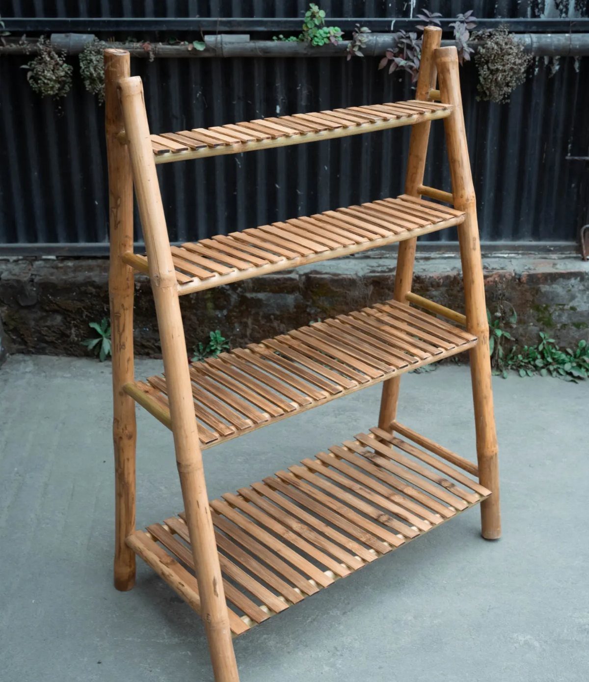 Small Wooden Rack Ideas: 9 Shelves, Stands and Holders 8 Light brown bamboo rack with four slatted shelves standing on a concrete floor.