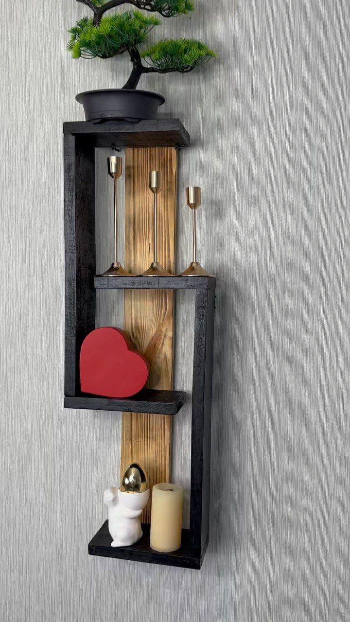 Small Wooden Rack Ideas: 9 Shelves, Stands and Holders 1 Staggered three-tier wooden wall shelf with dark and light brown finishes and decorations.