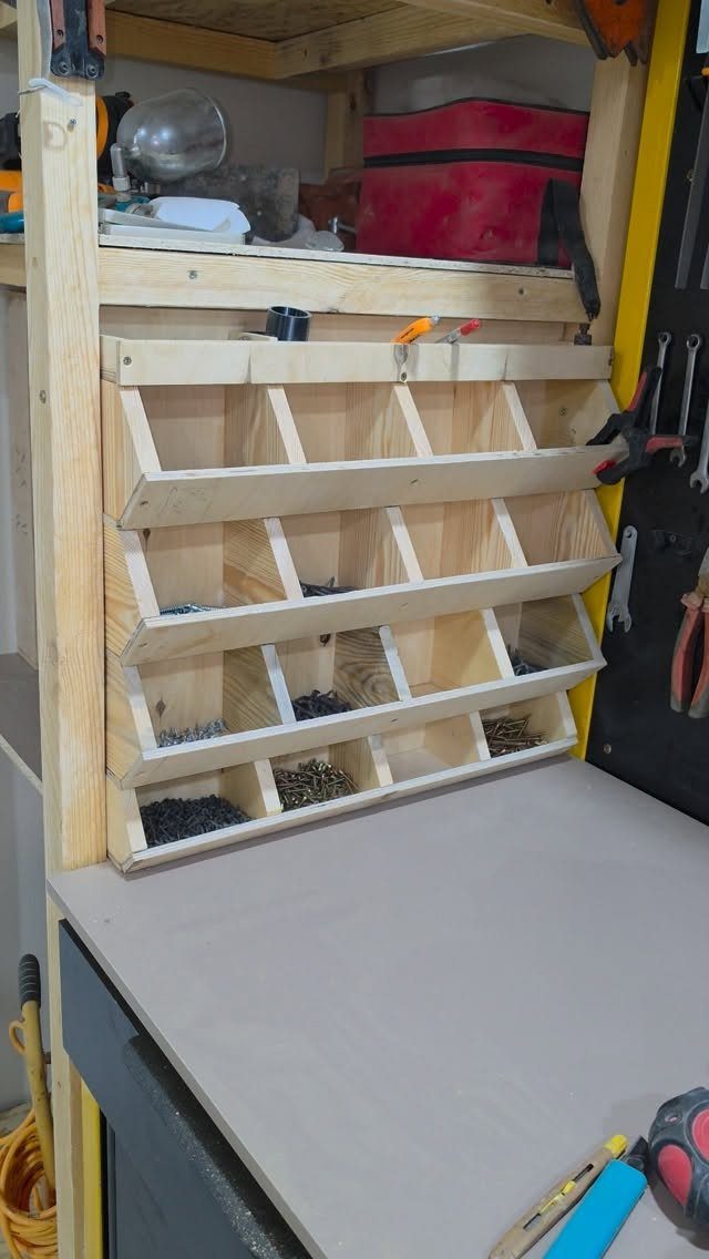 Small Woodworking Bench Ideas: 5 Designs for Tight Spaces 4 Small wooden workbench with a grey surface and integrated screw organizer bins.