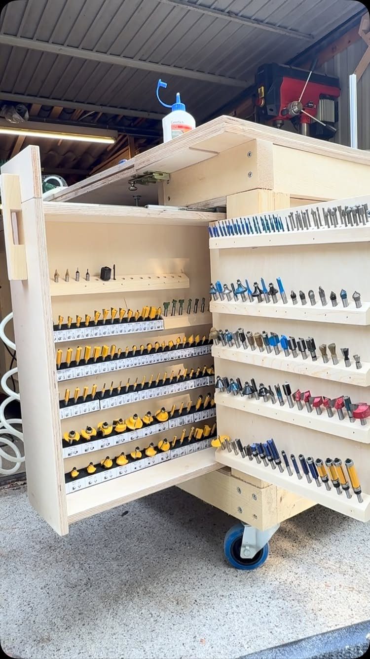 Small Woodworking Bench Ideas: 5 Designs for Tight Spaces 3 Small wooden woodworking bench with open tool storage and blue caster wheels.