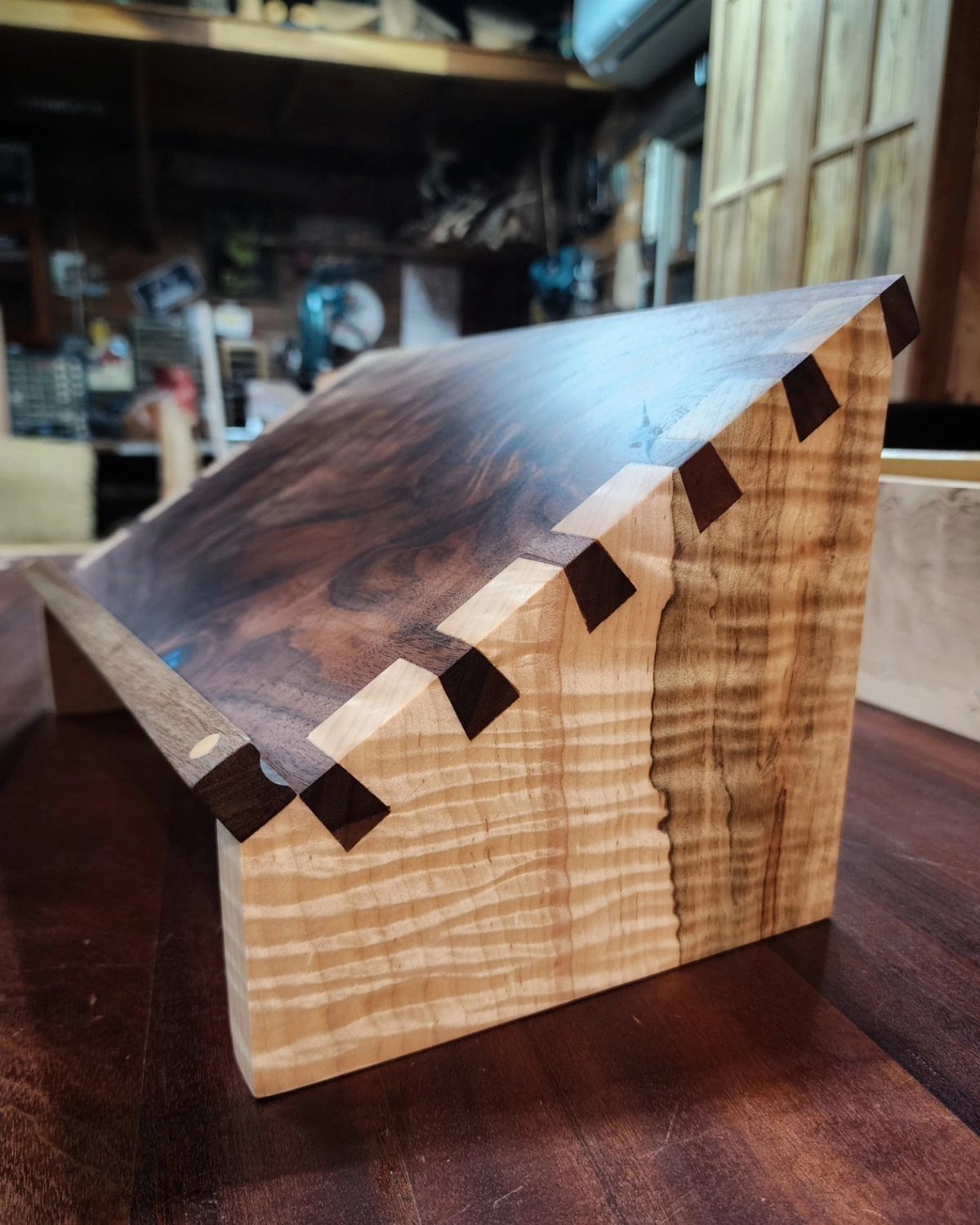 Table Saw Projects: 15 Ideas to Build This Weekend 14 Wooden box with a slanted lid and interlocking finger joints on a table