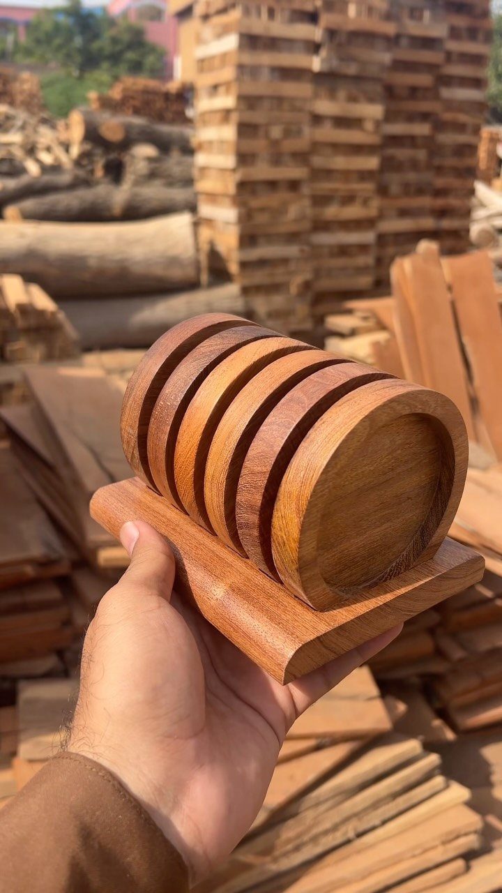 Table Saw Projects: 15 Ideas to Build This Weekend 6 Circular wooden coasters on a matching base held by a hand in a lumberyard.