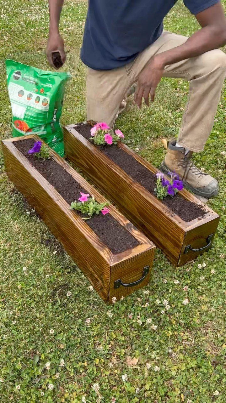 Table Saw Projects: 15 Ideas to Build This Weekend 2 Two wooden planter boxes with flowers and soil on a grassy lawn.