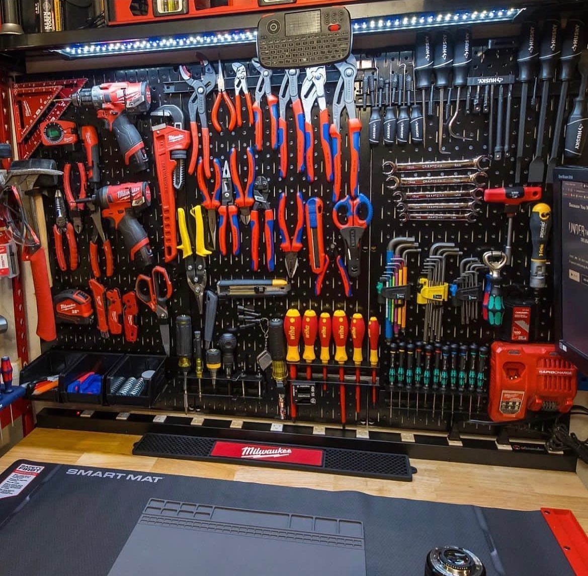 9 Tool Organization Wall Ideas for Garage and Shop 1 Black metal pegboard wall organized with a wide variety of professional hand tools.