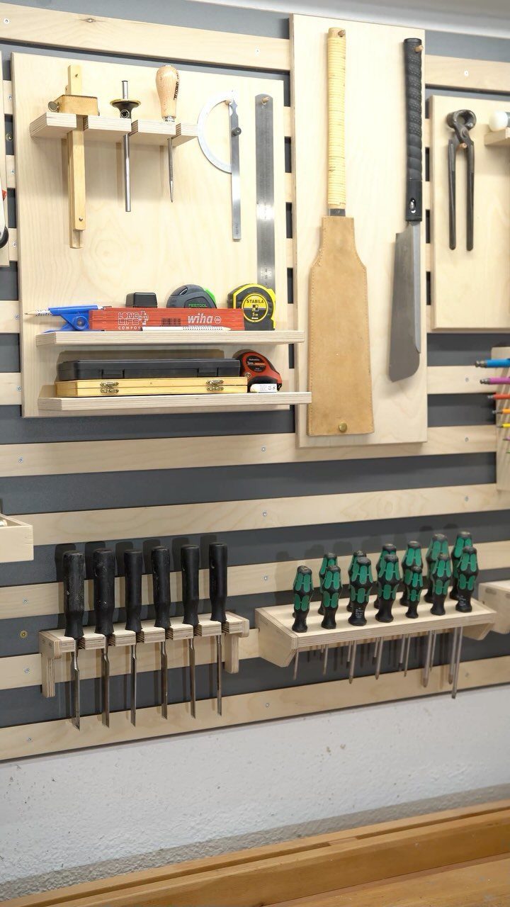 9 Tool Organization Wall Ideas for Garage and Shop 2 Wooden tool organization wall with neatly arranged hand tools on shelves and holders.