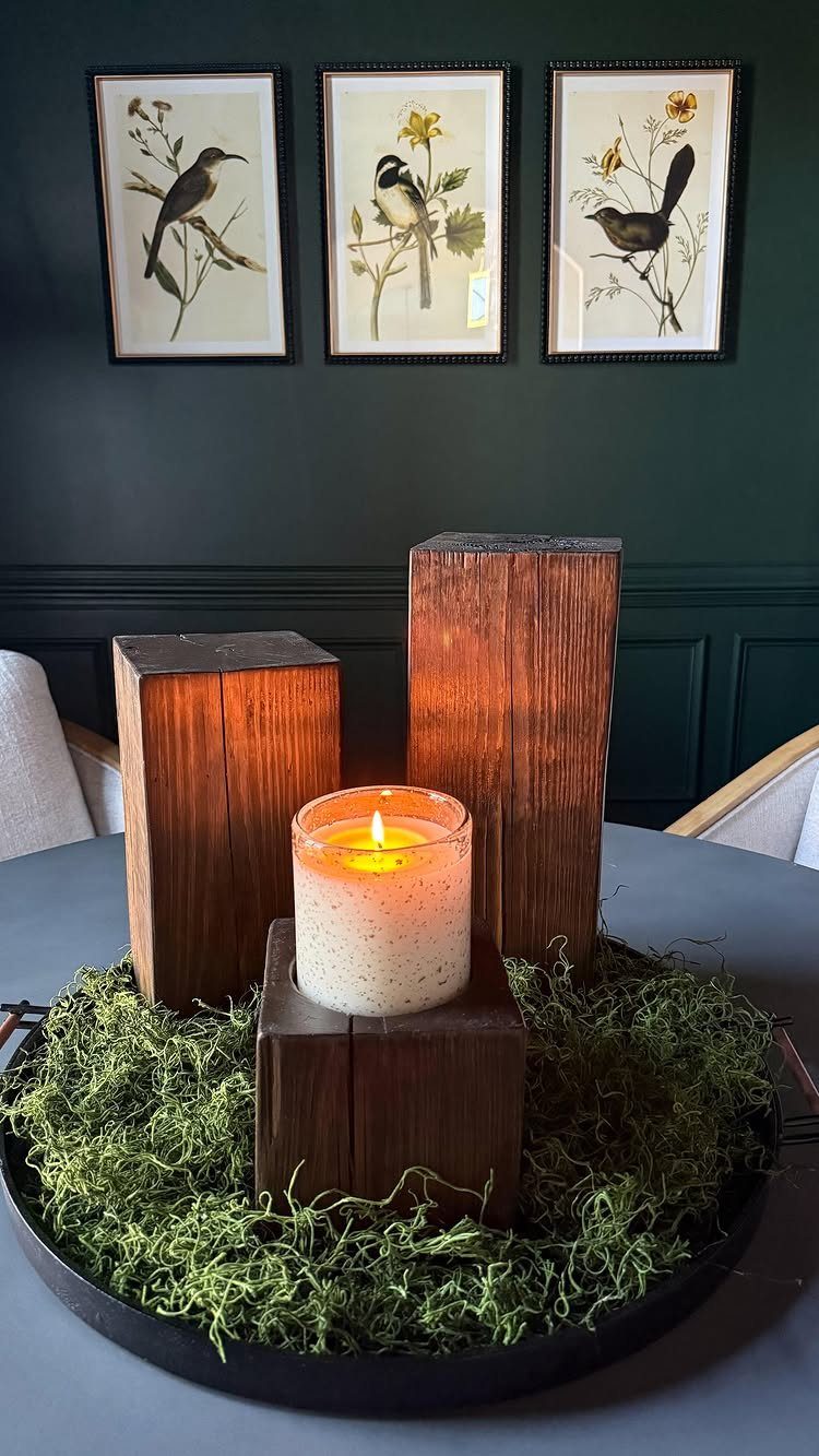 17 Wood Art Projects for Beginners and Weekend Makers 5 Wooden block candle holders on green moss with bird art in background