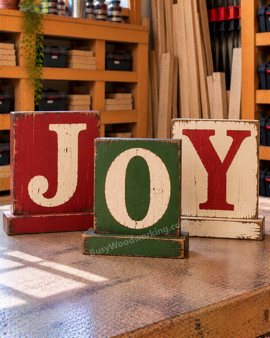 14 Wood Block Decorations for Every Season and Room 6 Three rustic wooden blocks spelling JOY in red, green, and white colors.