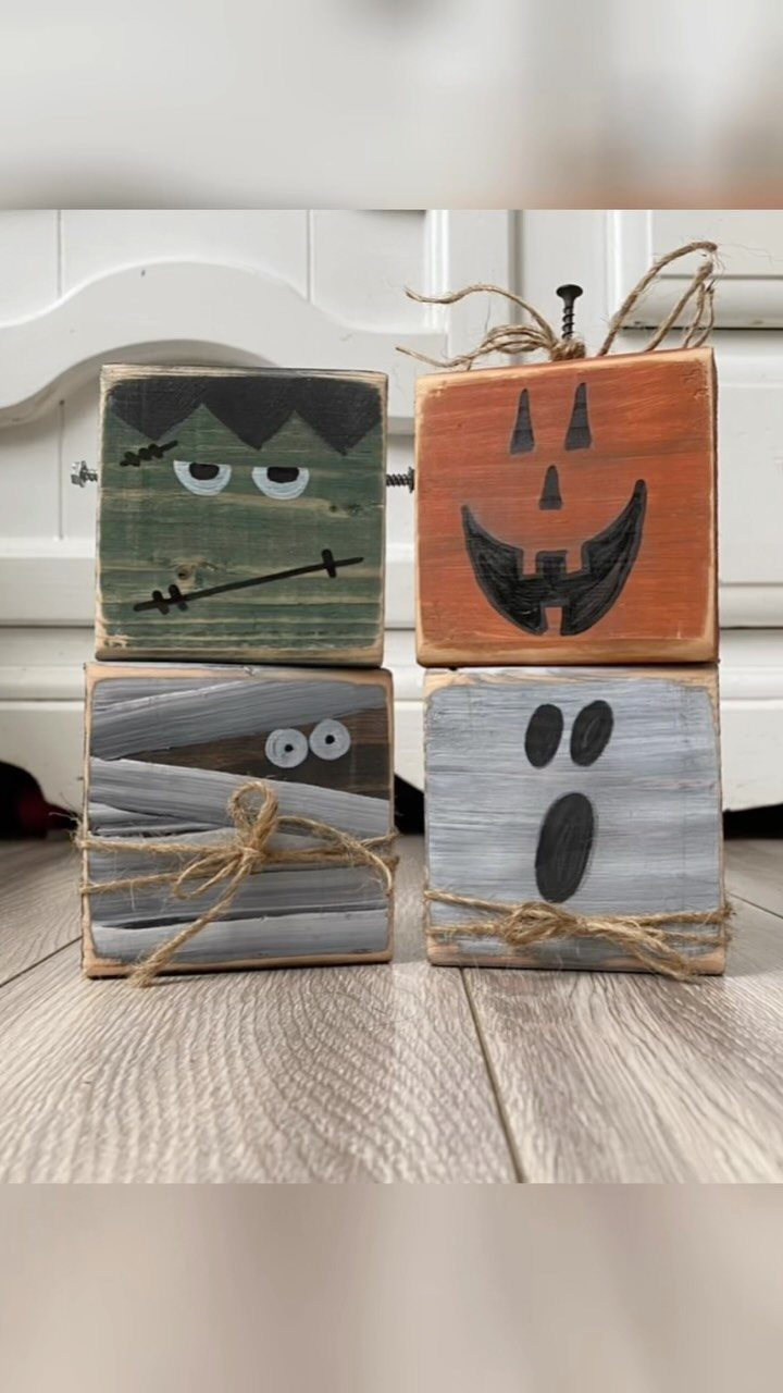 14 Wood Block Decorations for Every Season and Room 2 Four painted wooden blocks depicting a monster, pumpkin, mummy, and ghost for Halloween.