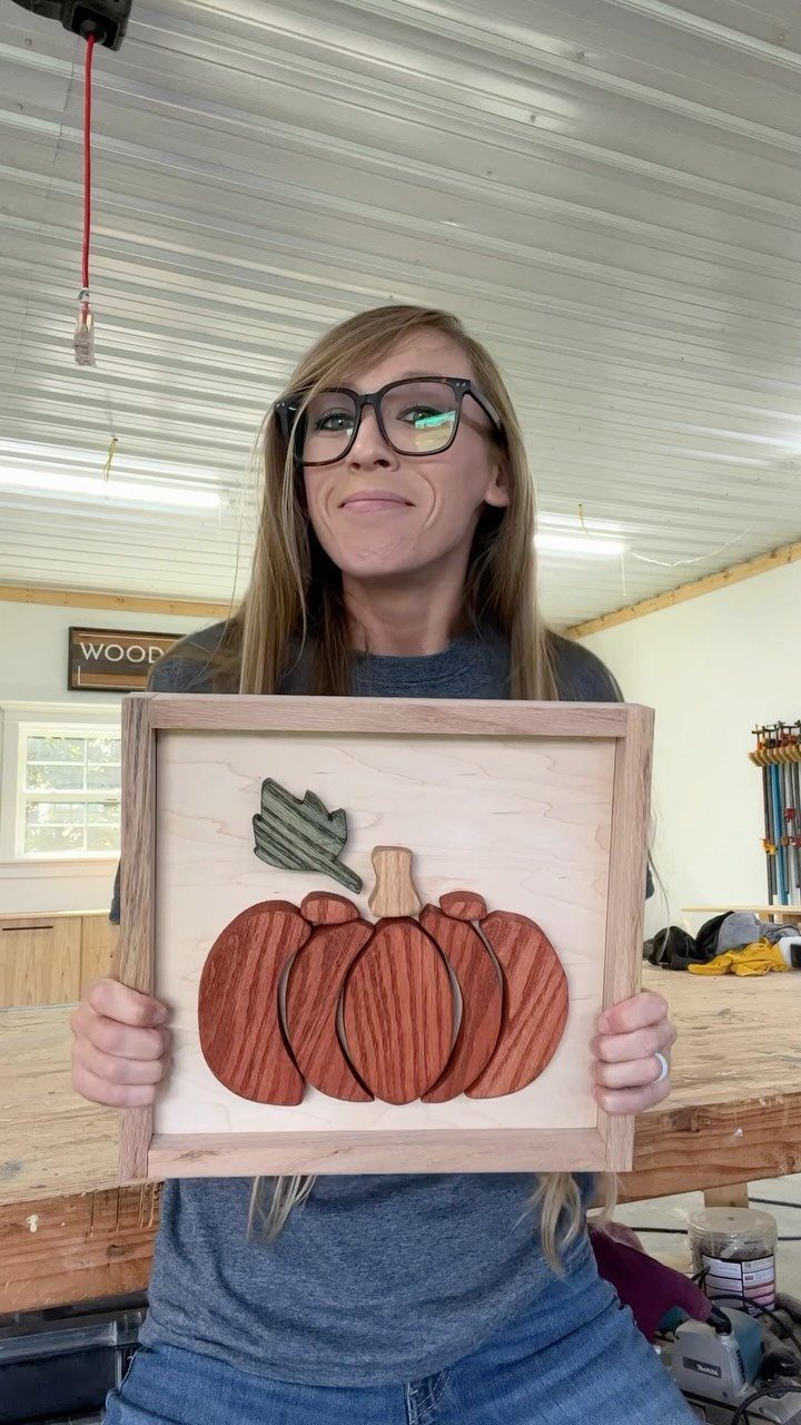 14 Wood Block Decorations for Every Season and Room 1 Wooden pumpkin made of layered blocks inside a square light wood frame.