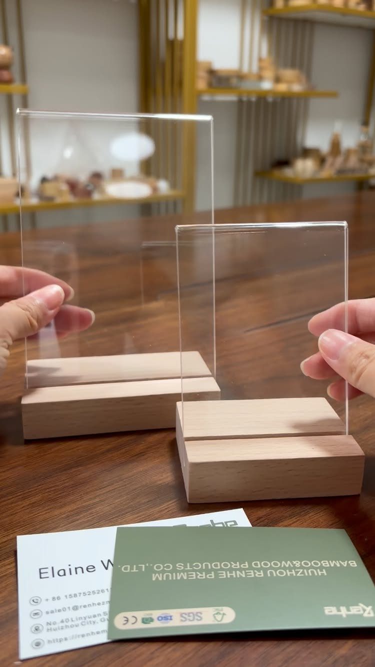14 Wood Block Decorations for Every Season and Room 12 Clear acrylic signs held in light wooden block bases on a dark table.