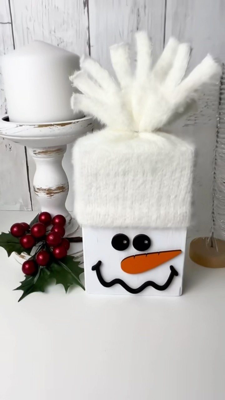 14 Wood Block Decorations for Every Season and Room 3 Wooden block snowman with a white fuzzy hat, orange nose, and black smile.