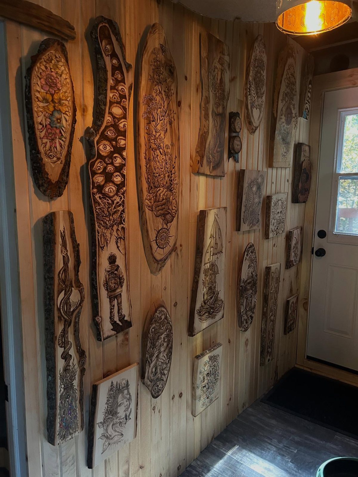 9 Wood Burning Images for Spoons, Plaques and Coasters 3 Burned pyrography art on wooden slabs hanging on a light wood plank wall