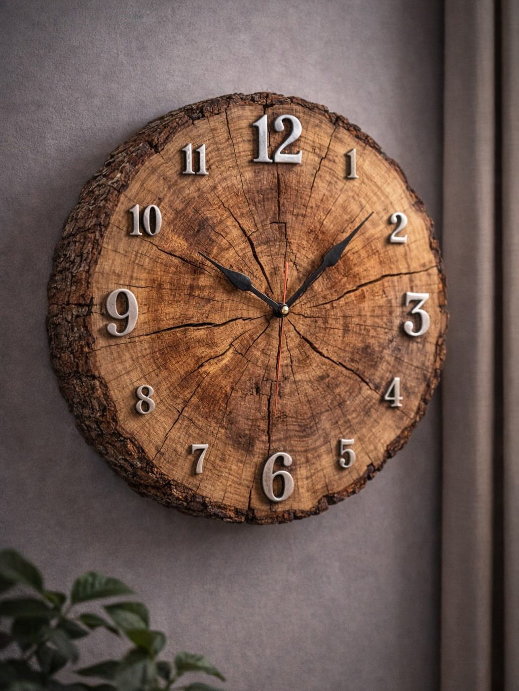 Wooden wall clock made from a natural log slice with silver numbers.