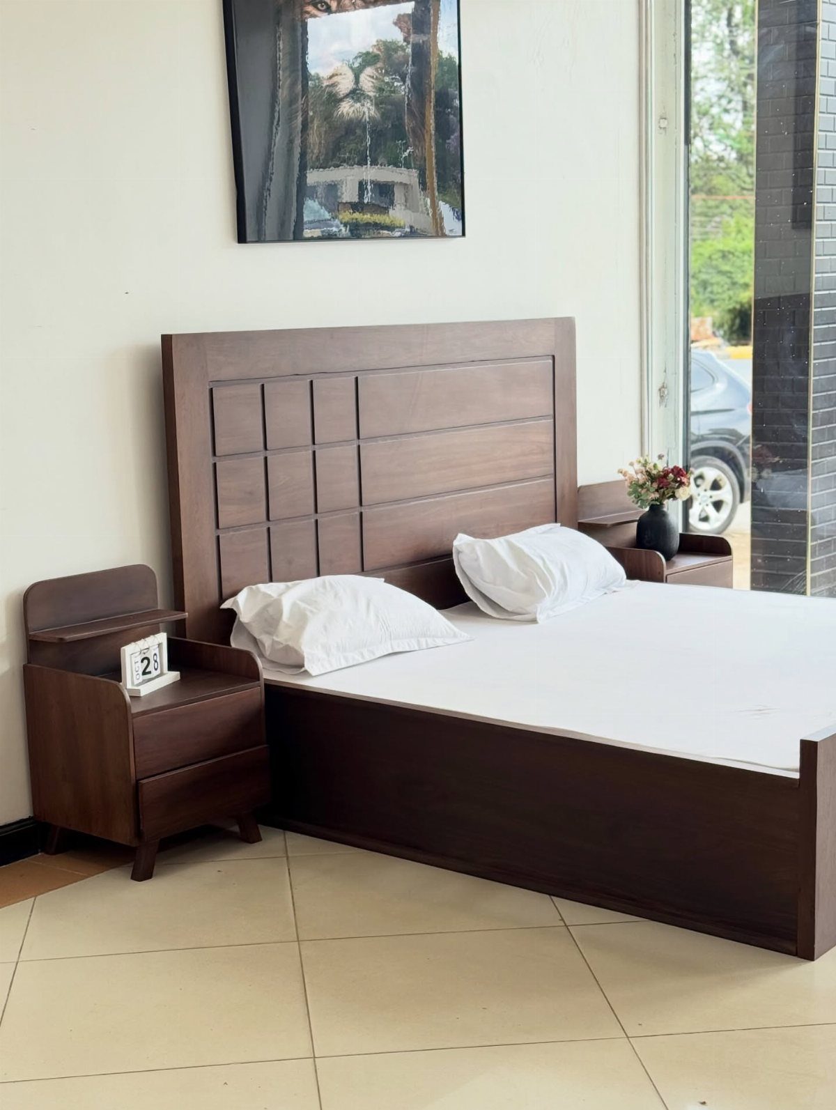 Dark brown wooden bed frame with a paneled headboard and matching nightstand.
