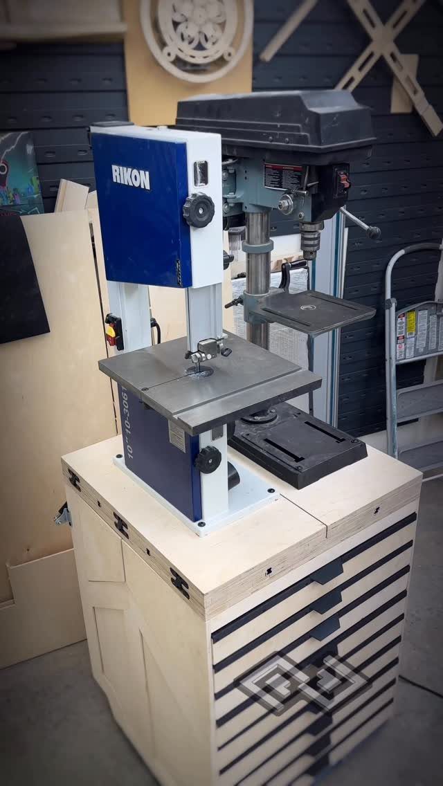 Rikon band saw and drill press on a custom wooden workbench with drawers