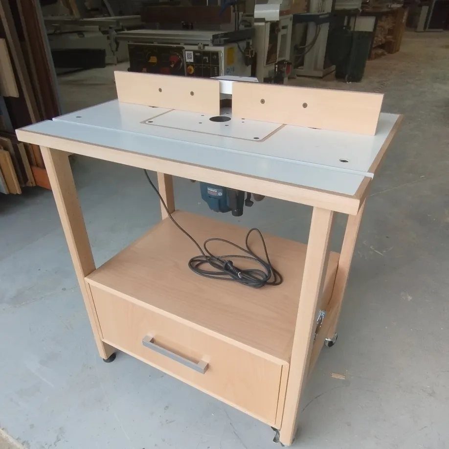 8 Woodshop Design Ideas for Smarter Storage and Layout 8 Wooden router table with white top and storage shelf in a workshop setting