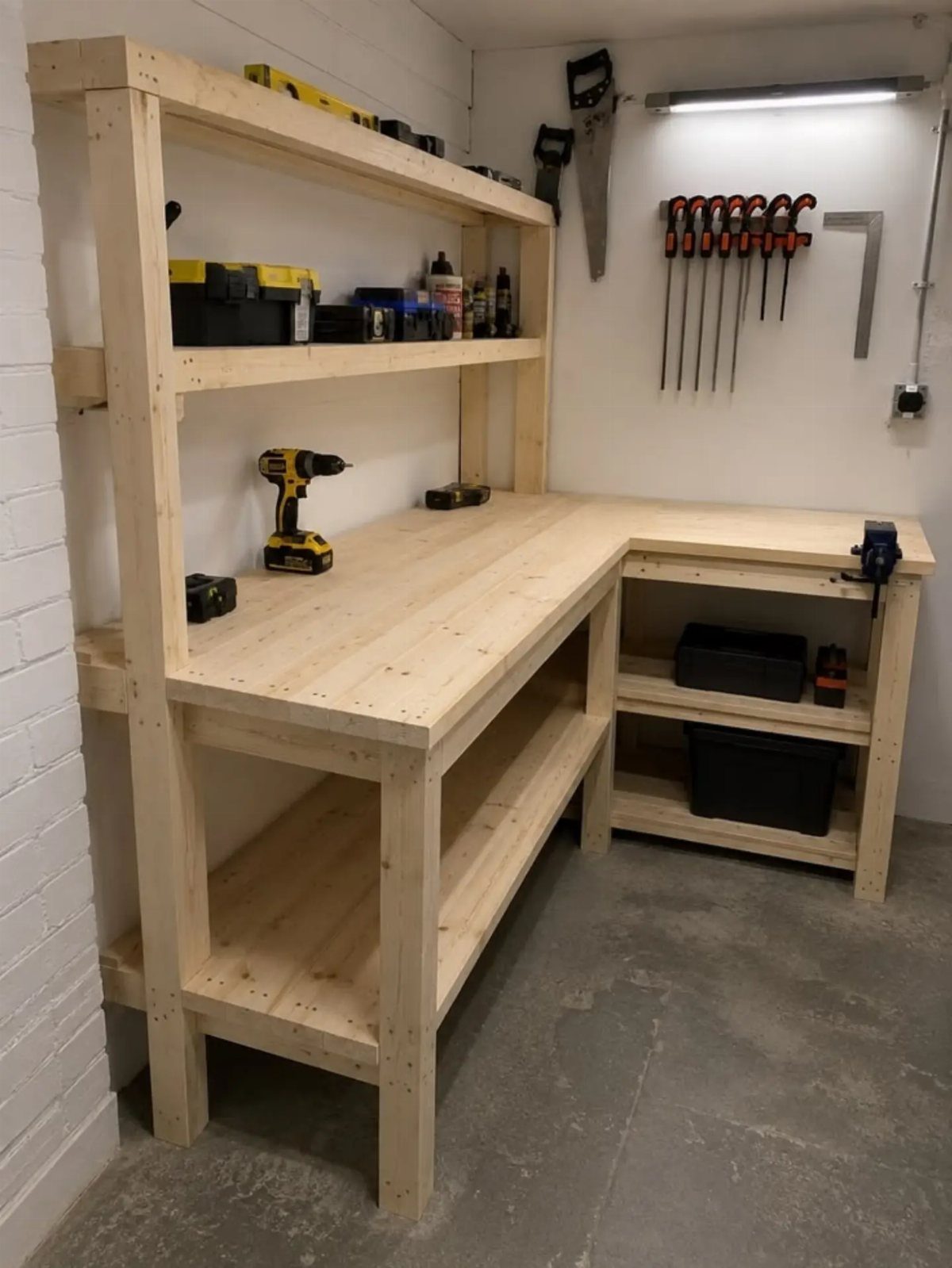 8 Woodshop Design Ideas for Smarter Storage and Layout 7 L-shaped wooden workbench with integrated shelving in a white-walled workshop.