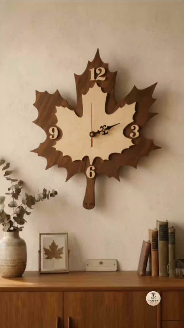 Maple leaf shaped wooden wall clock mounted on a neutral wall above furniture.