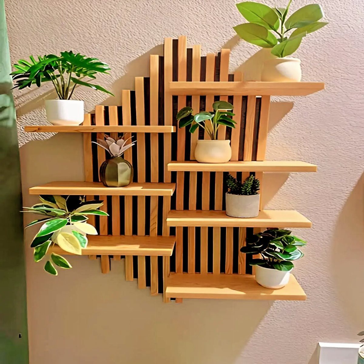 Wooden wall shelf unit with vertical slats holding several small potted green plants.