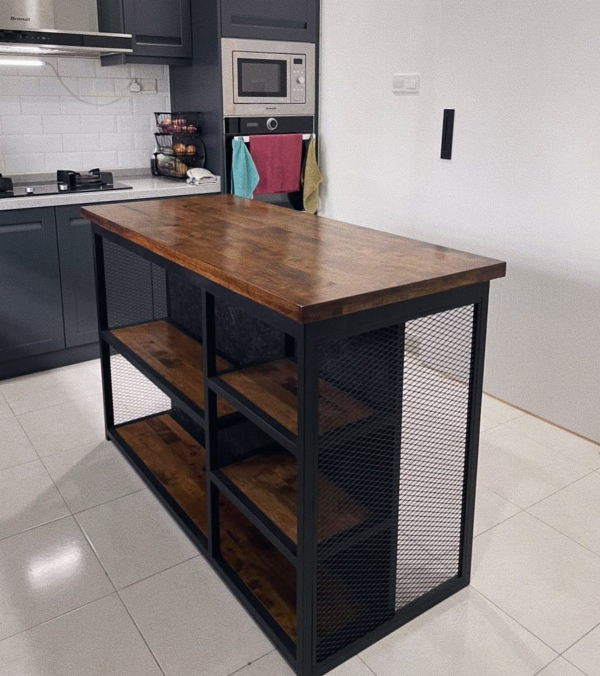 14 Woodworking Shop Projects for Every Skill Level 4 Wooden kitchen island with black metal frame and open shelving in a modern kitchen