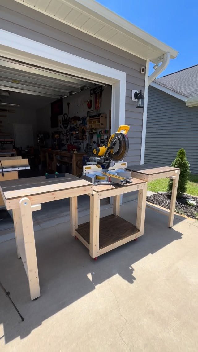 14 Woodworking Shop Projects for Every Skill Level 6 Wooden miter saw station with extended side wings holding a yellow power saw.