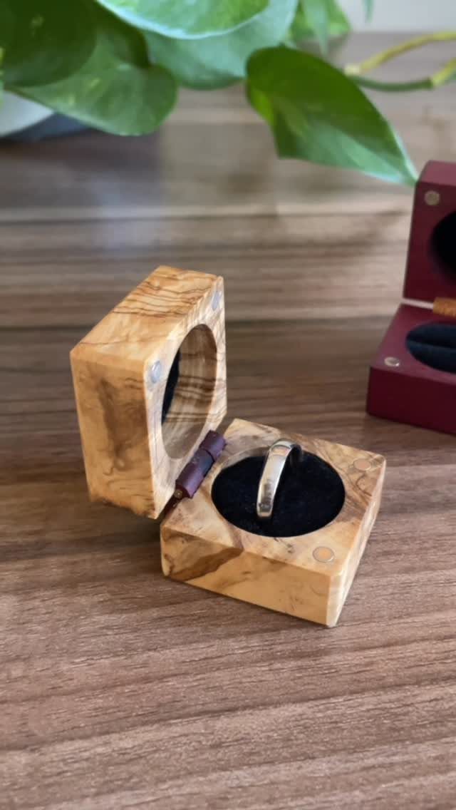 Woodworking Small Box Ideas: 5 Projects to Build 2 Small wooden jewelry box holding a silver ring on a wooden surface.