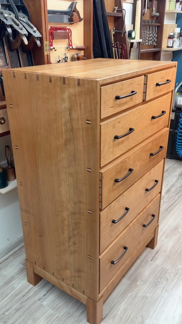 Woodworking Tool Cabinet Plans: 8 Storage Ideas 5 Wooden tool cabinet with multiple drawers and metal handles in a woodworking shop.