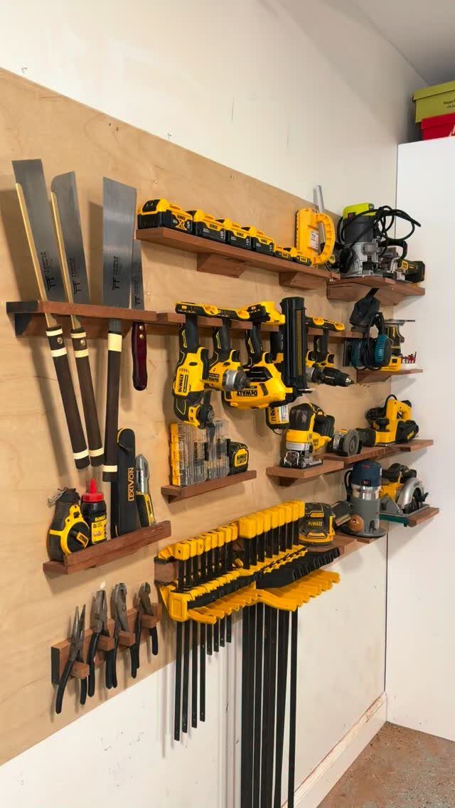 Workbench Tool Storage Ideas: 8 Setups for a Garage Shop 8 Yellow and black power tools organized on wooden wall-mounted shelves and racks.