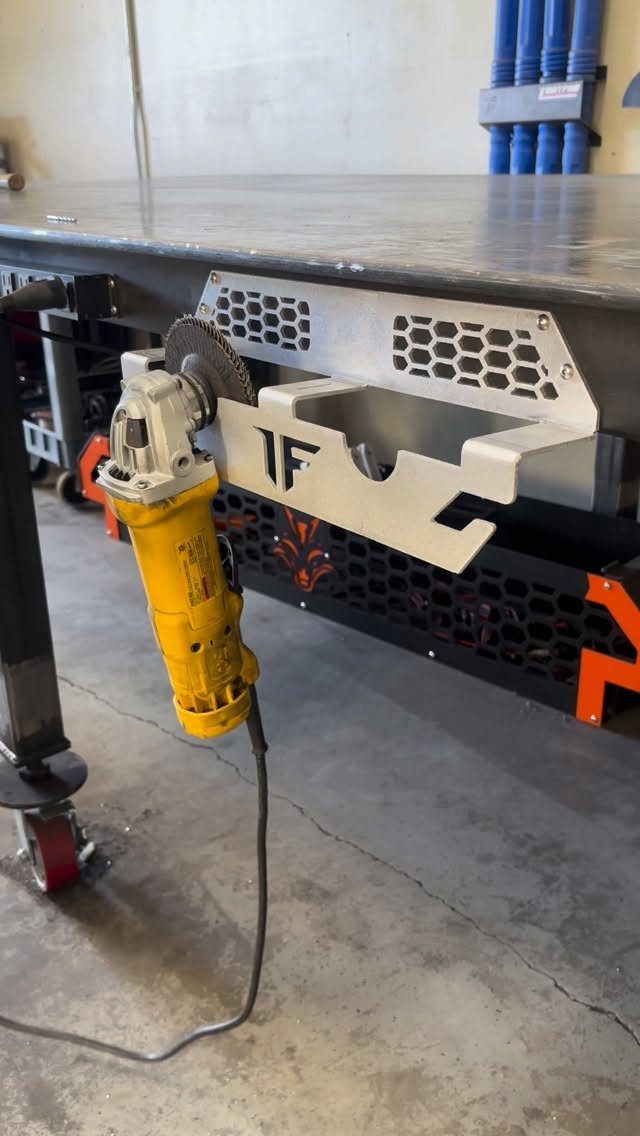 Workbench Tool Storage Ideas: 8 Setups for a Garage Shop 7 Yellow angle grinder stored in a custom metal bracket on a workbench side